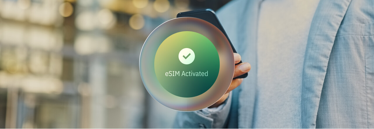 A person holding a phone with a circular graphic displaying "eSIM Activated" and a checkmark.
